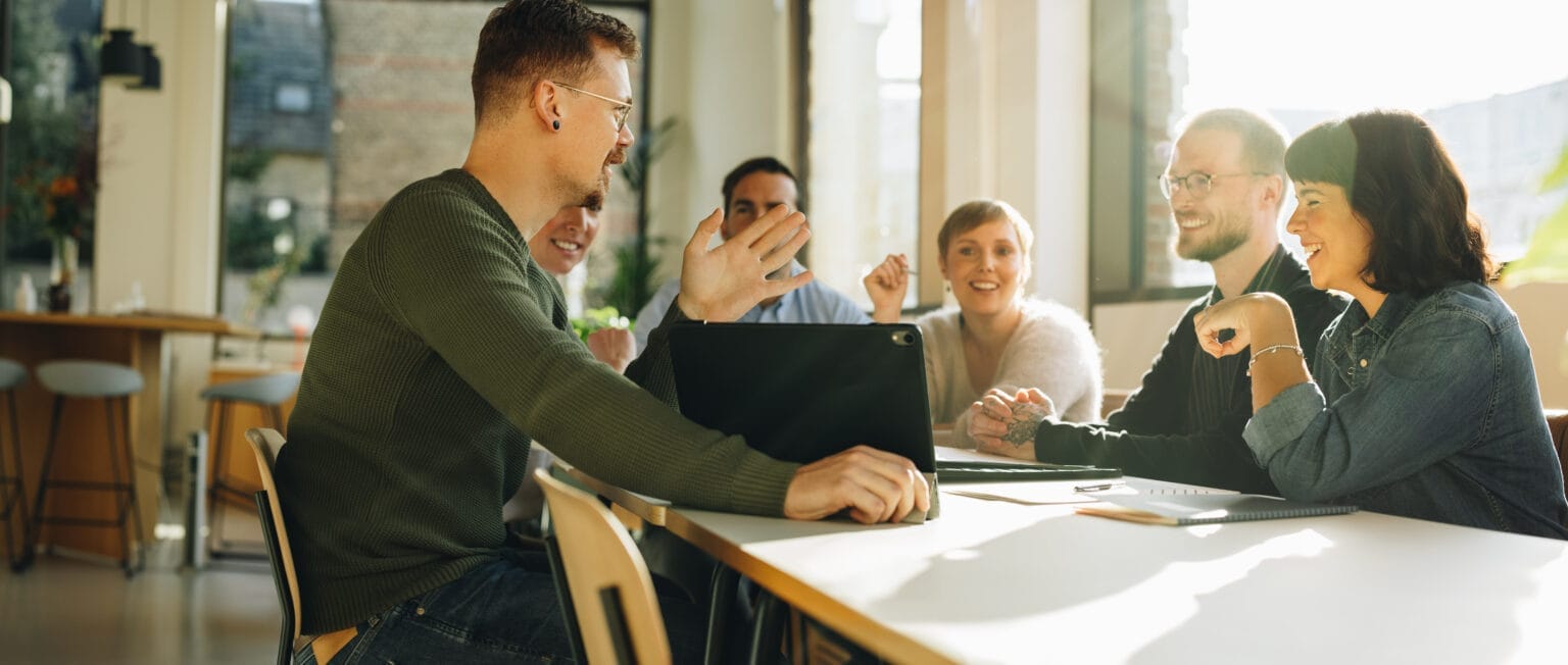 a group of people sitting at a table